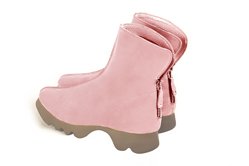 Light pink women's ankle boots with a zip at the back. Round toe. Flat rubber soles. Rear view - Florence KOOIJMAN